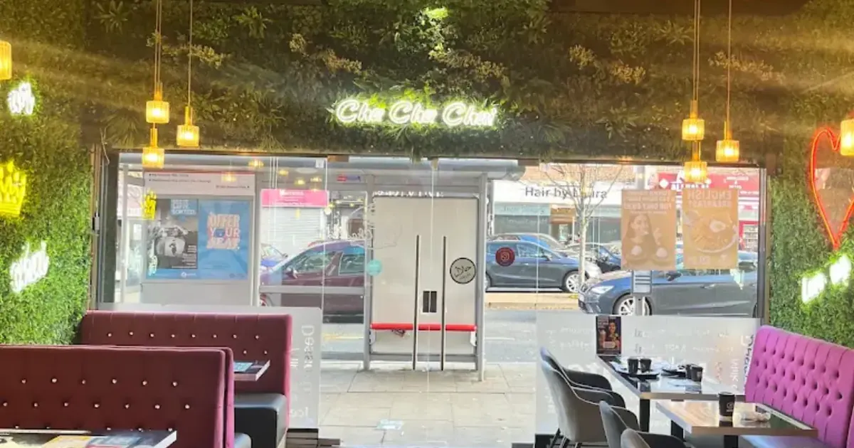 Inside Cha Cha Chai: a planted ceiling between gold lattice panels, velvet booths and a glass front looking onto Joel Street